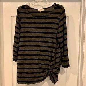 Long sleeved gray and navy stripped shirt.